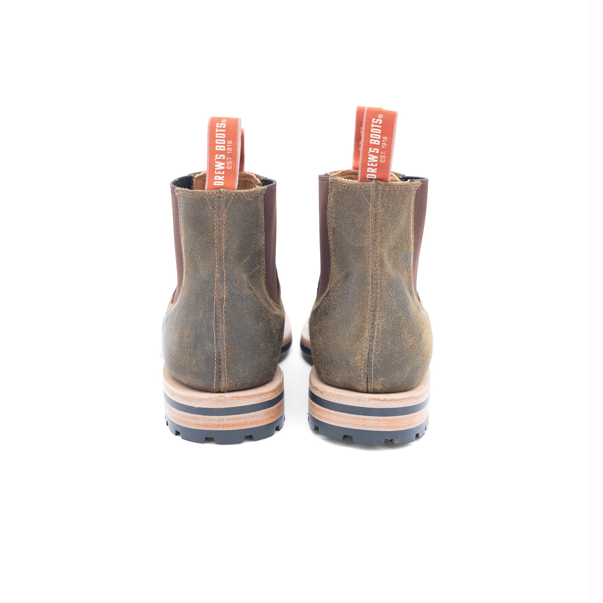 Pair of brown boots with visible brand name on a white background